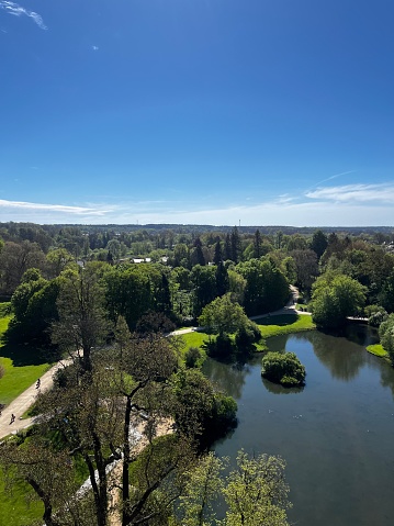 A large, beautiful lake, top view, surrounded by a well-kept park with beautiful trees, nature