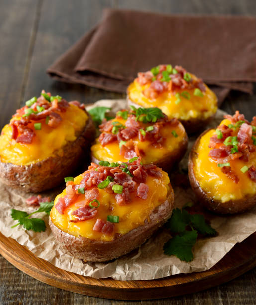 istock Baked stuffed potatoes with bacon, green onion and cheddar cheese 2150938930