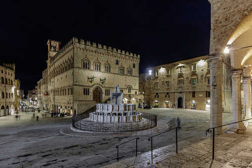 Perugia, Umbria, Italy - April 26, 2024: Piazza Quattro Novembre with the Fontana Maggiore and the Palazzo dei Priori, at night.