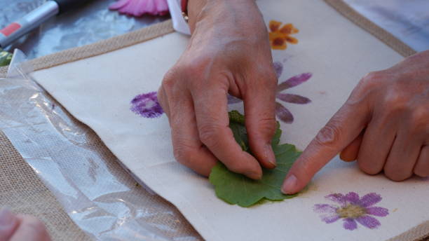 istock Eco print on fabric with fresh flowers. 2150943431