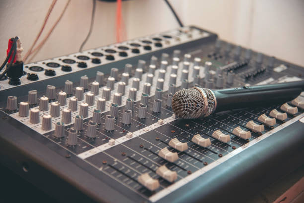 istock Production sound engineer hands working on recording studio mixing voice control. Expert adjusting volume equalizer voice, mixing console DJ sound engineering. Producer remix tune music sound record 2150944131