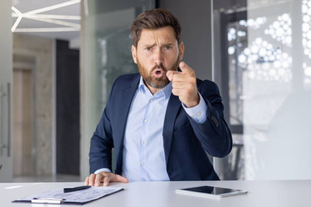 istock Businessman in blue suit angrily pointing during a video call 2150945587