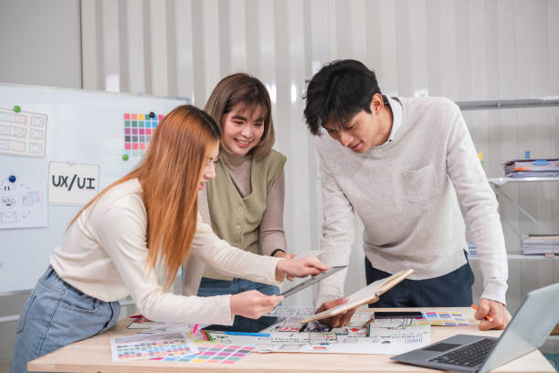 istock A team of designers helps develop the application system. Brainstorm ideas for making ux ui to develop programs 2150945967