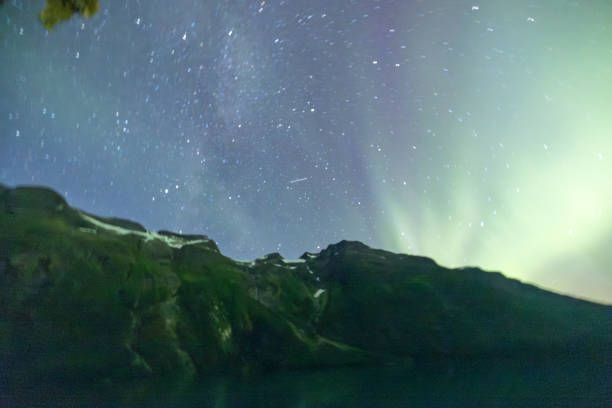 istock The Northern Lights in a Starry Sky, Over Mountains 2150946527