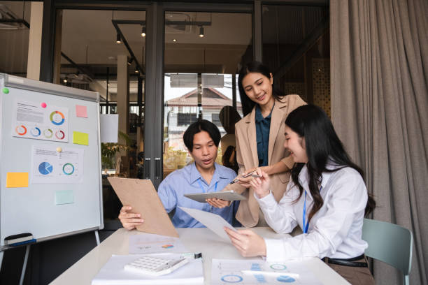 istock Business team meeting where the team leader is presenting a work plan graph. Discuss and summarize work results in the conference room. 2150946924