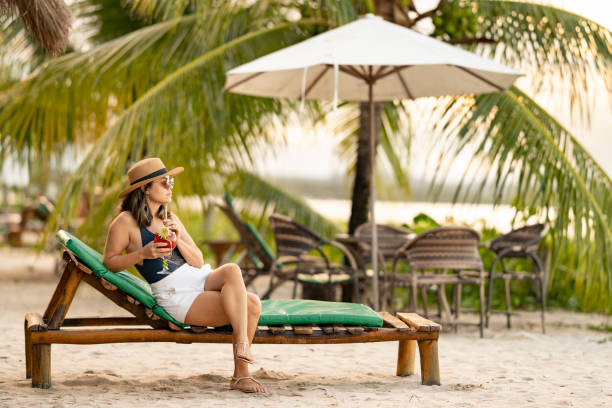 istock Woman relaxing on beach chair 2150947294