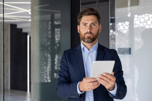 istock Confident businessman with tablet in a modern office 2150949867