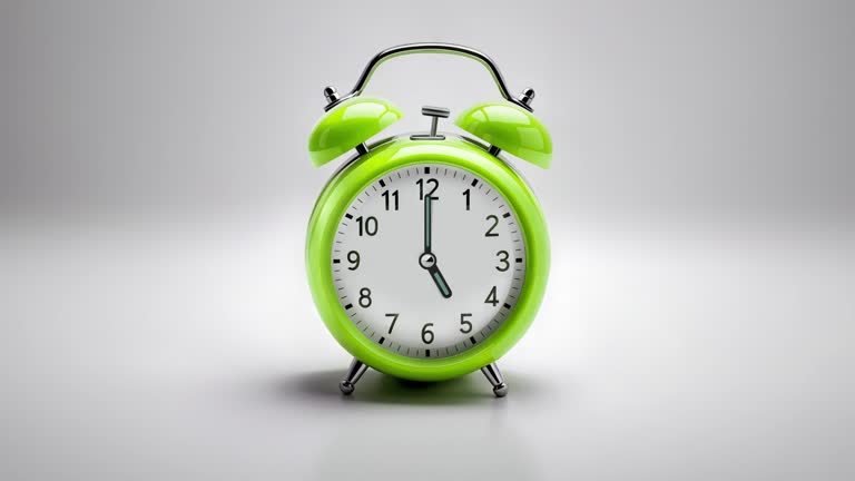 Alarm clock ringing at 05:00 o'clock. It's ticking quickly  on a white background in the studio lights. The concepts of speed, time, deadline, waking up, stress, bell rings, hour, time lapse, schedule, calendar date, finalize, retro style