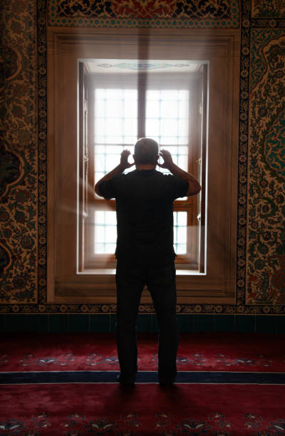 Muslim man reading Koran