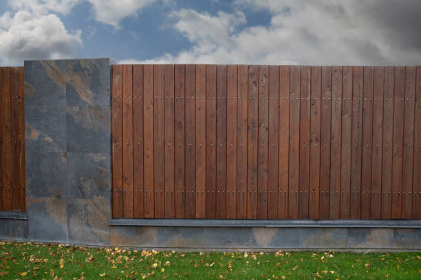 istock Brown wooden fence with linear planks 2150952411