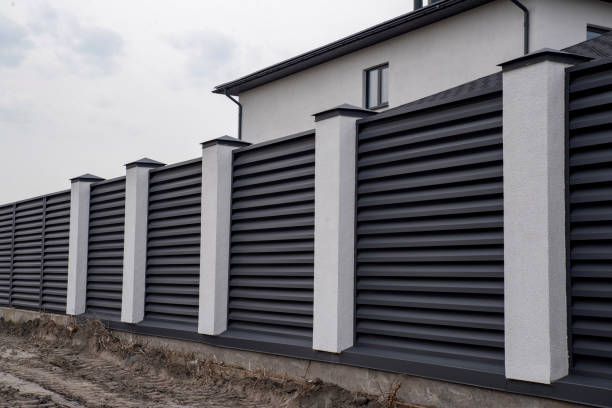 istock Modern gray metal shutter fence with stucco column 2150953102
