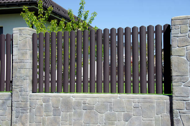 istock Stone fence and metal picket 2150953150