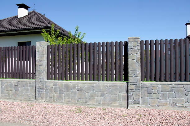 istock Stone fence and metal picket 2150953153
