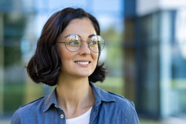istock Confident student smiling outdoors on a sunny campus day 2150953709