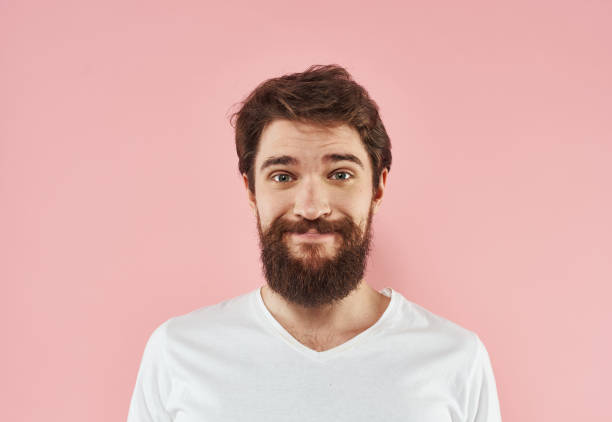 istock Man with beard and mustache white t-shirt pink background 2150955826