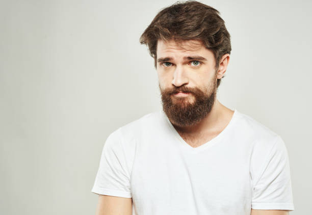 istock Man in t-shirt cropped view model sad face emotions 2150956752