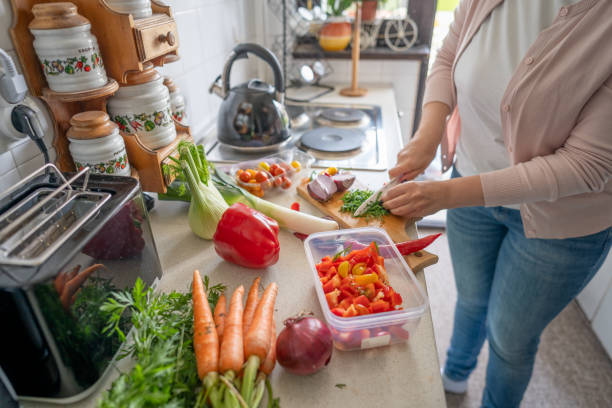 istock Unrecognizable person preparing fresh salad 2150957074