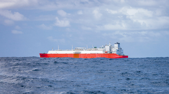 Sea-based gas tanker is en route through the rough waters of the Southern Ocean.  Special vessel for the transportation of liquefied gas transports products in tanks or reservoirs.