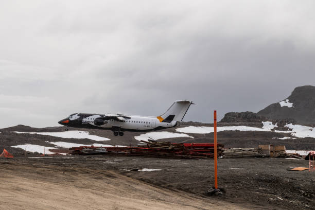 King George Island, Antarctica  - February 3, 2024. A british Bae 146, also known as the AVRO RJ, operated by Antarctic airways, or DAP airlines, approaches King George island, to pick up Antarctic tourists.