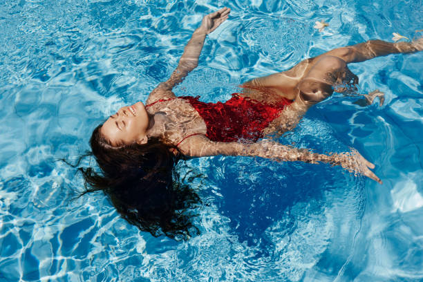 istock Woman water female pool blue summer 2150959711
