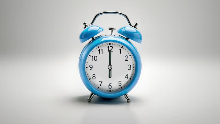 Alarm clock ringing at 06:00 o'clock. It's ticking quickly  on a white background in the studio lights. The concepts of speed, time, deadline, waking up, stress, bell rings, hour, time lapse, schedule, calendar date, finalize, retro style