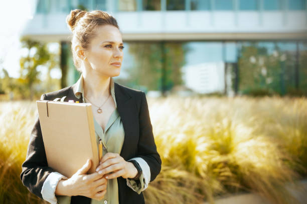 istock pensive modern woman worker in business district 2150966666