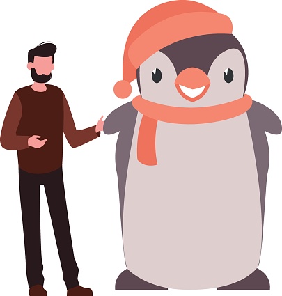 The boy stands next to the penguin.