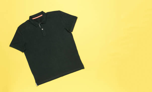 Classic men's polo shirt on a yellow background.