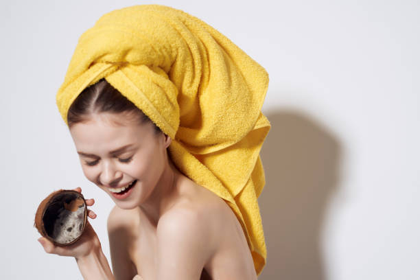 istock woman with bare shoulders coconut fruit freshness tropics 2150968890