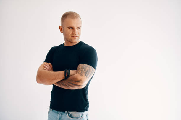 istock Confident handsome man with arms crossed looking to copy space 2150970912