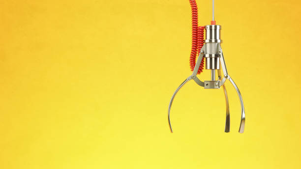 Machine  claw on yellow background. Crane game.