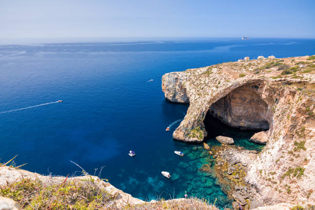 the blue grotto arch seen from above (malta) - grotte stock-fotos und bilder