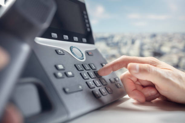 istock Dialing a landline telephone in the office 2150975332
