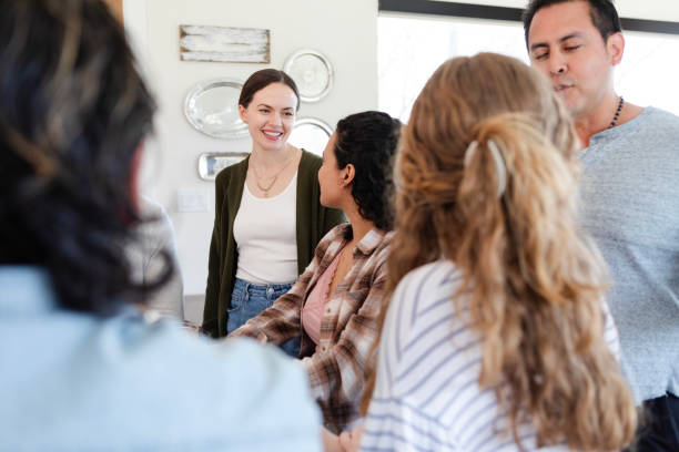 istock Diverse friends crowd into kitchen area during get-together 2150977454