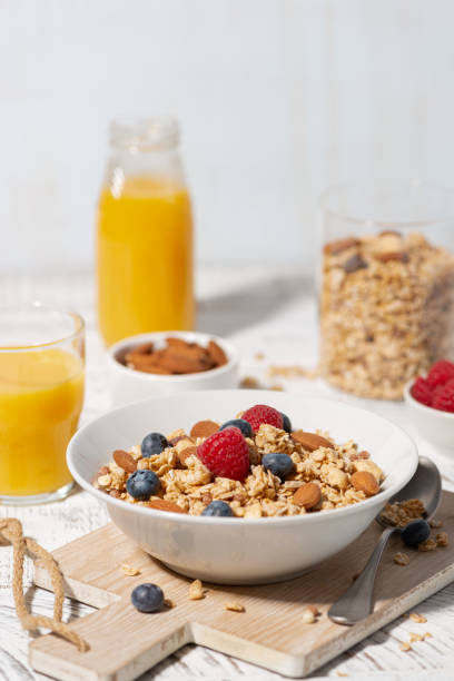 istock homemade breakfast with granola with nuts and berries, vertical 2150977832
