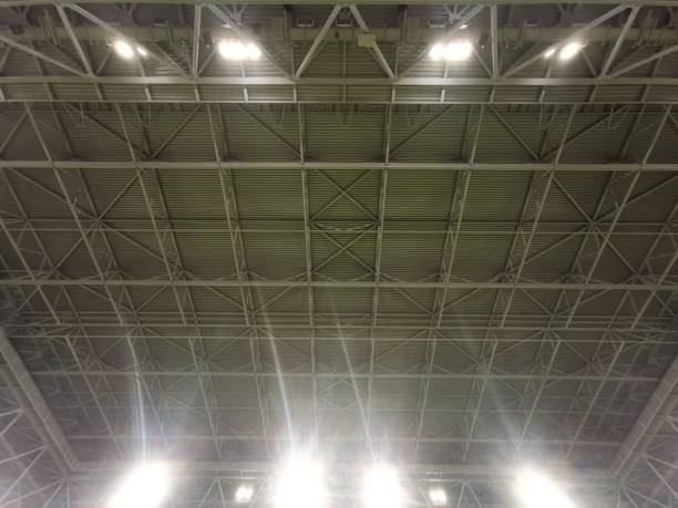 istock Illuminated spotlights in a football stadium with electrically closable roof 2150977932