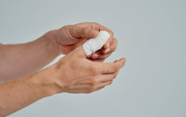 istock bandaged thumb health problems medicine isolated background 2150980026