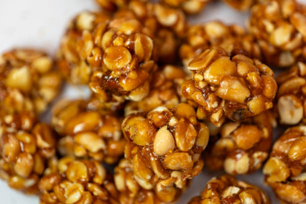 istock A close-up of a dozen chikki peanut balls on a white background 2150980606
