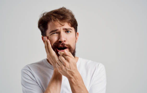 istock bearded man health problems dental pain injury 2150980709