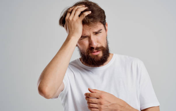 istock bearded man holding his head discontent health problem disorder 2150982056