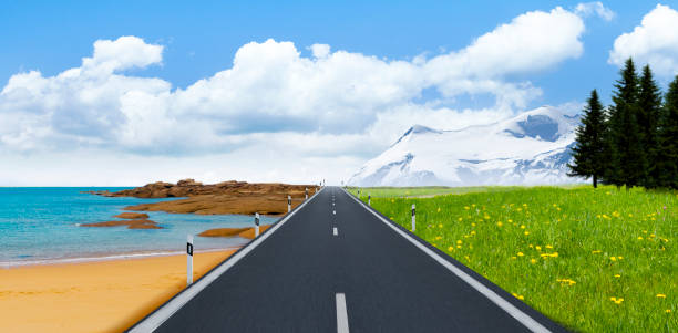 Road between the sea coast and snow-covered high mountains