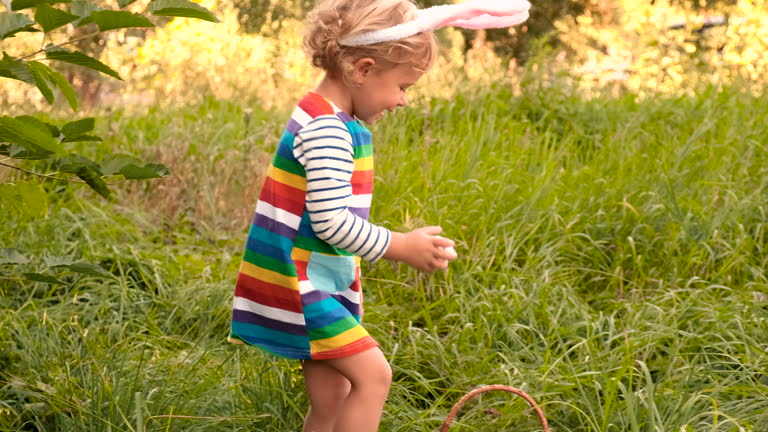 a child collects Easter eggs on the field. Selective focus. kid.