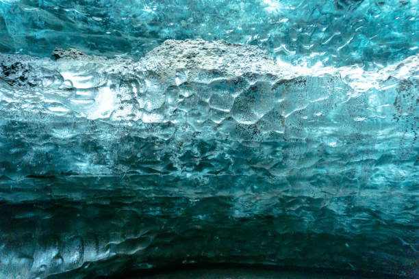 Close-up of icicles and snow formations in an icy cave, showcasing the beauty of winter's natural sculptures.