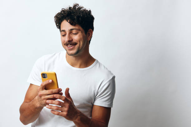 istock White man phone t-shirt message hipster online technology 2150987210