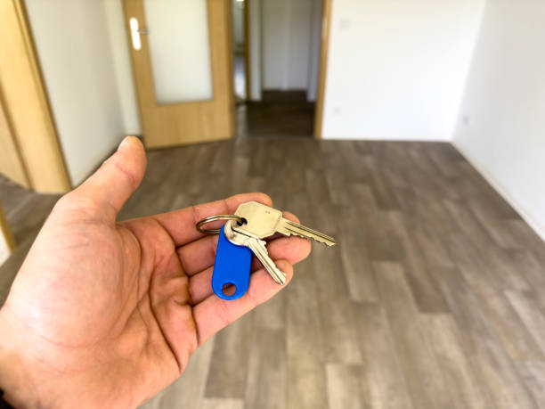 istock Apartment key in hand in a new apartment when moving in 2150987762