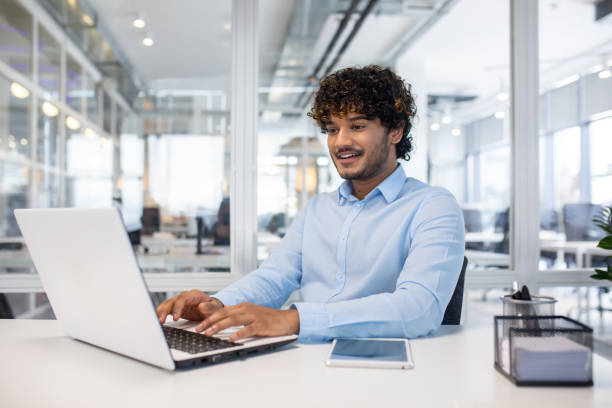 istock Professional man working on laptop in modern office 2150988877