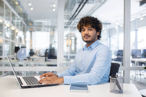 istock Professional working on a laptop in a modern office space 2150989946