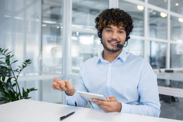 istock Friendly call center agent assisting with inquiries over video chat 2150994087