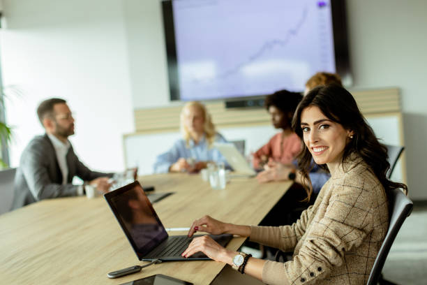 istock Radiant professional woman excels during a dynamic office meeting in bright workspace 2150994223