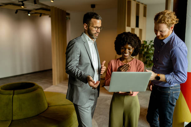 istock Creative team engaging in a lively brainstorming session at a colorful office space 2150994234